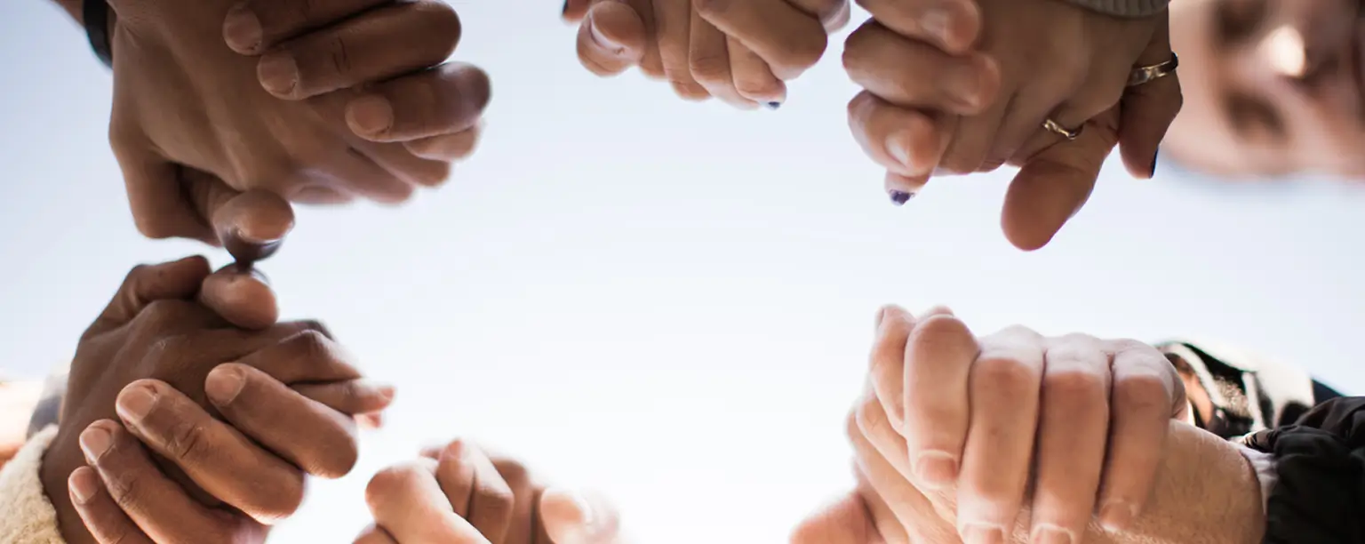 Hero image with people holding each other hands